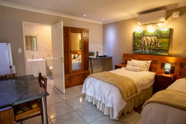 Room 9 — Wide angle showing full room with en-suite and amenities